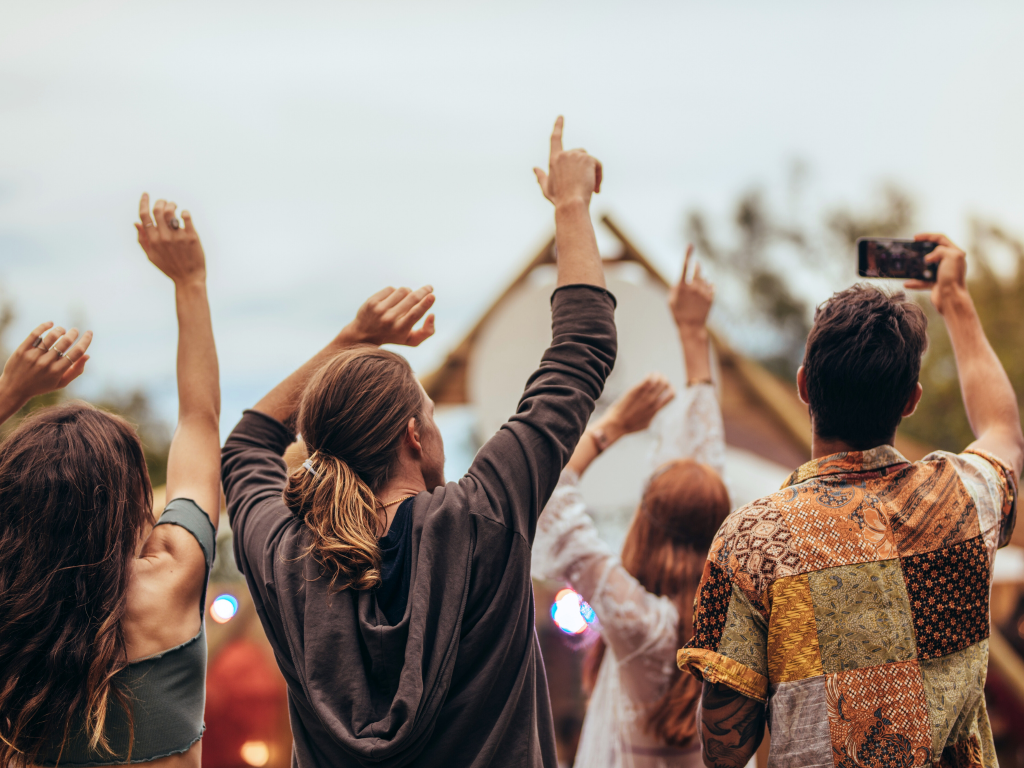 A crowd enjoying drinks from our festival bar hire services.